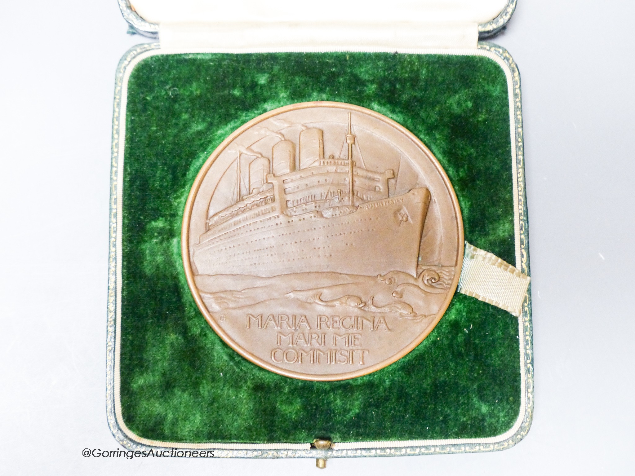 A cased RMS Queen Mary maiden voyage 1936 bronze medal designed by Gilbert Bayes